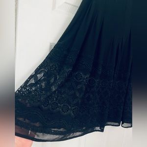 lace netting overlay fully lined skirt, side invisible zip, stitched down pleats